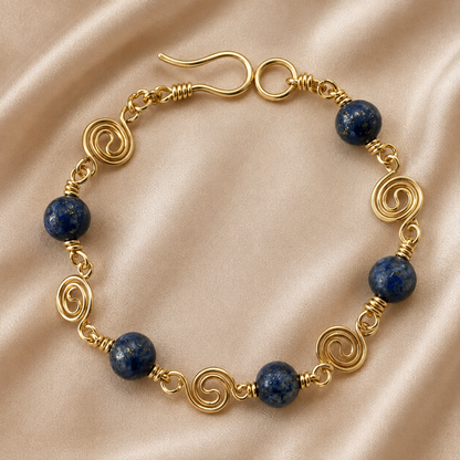 Lapis lazuli bead bracelet with gold-plated spiral wire details and handmade clasp