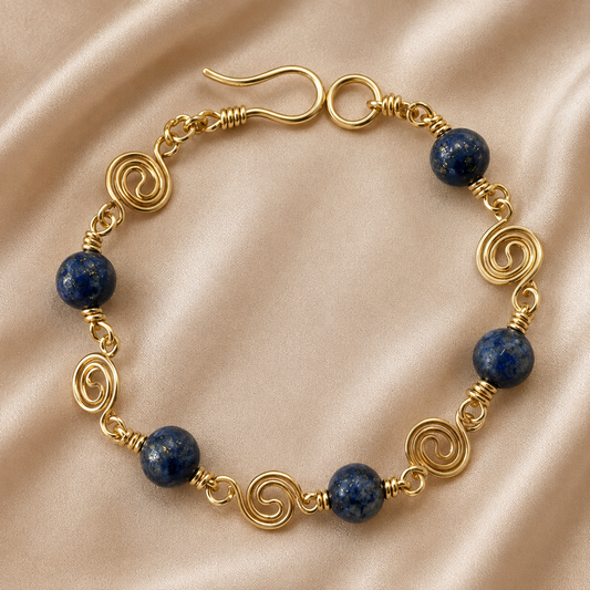 Lapis lazuli bead bracelet with gold-plated spiral wire details and handmade clasp