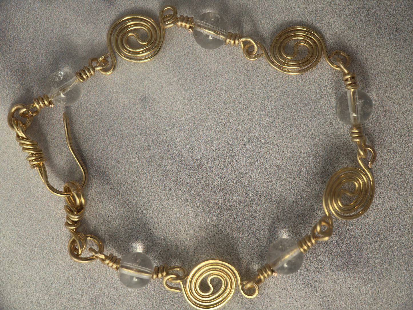 Gold Plated Spiral Bracelet with Clear Quartz Beads